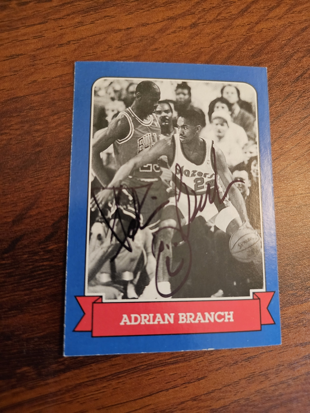 Signed vintage-style Adrian Branch basketball card with Michael Jordan guarding
